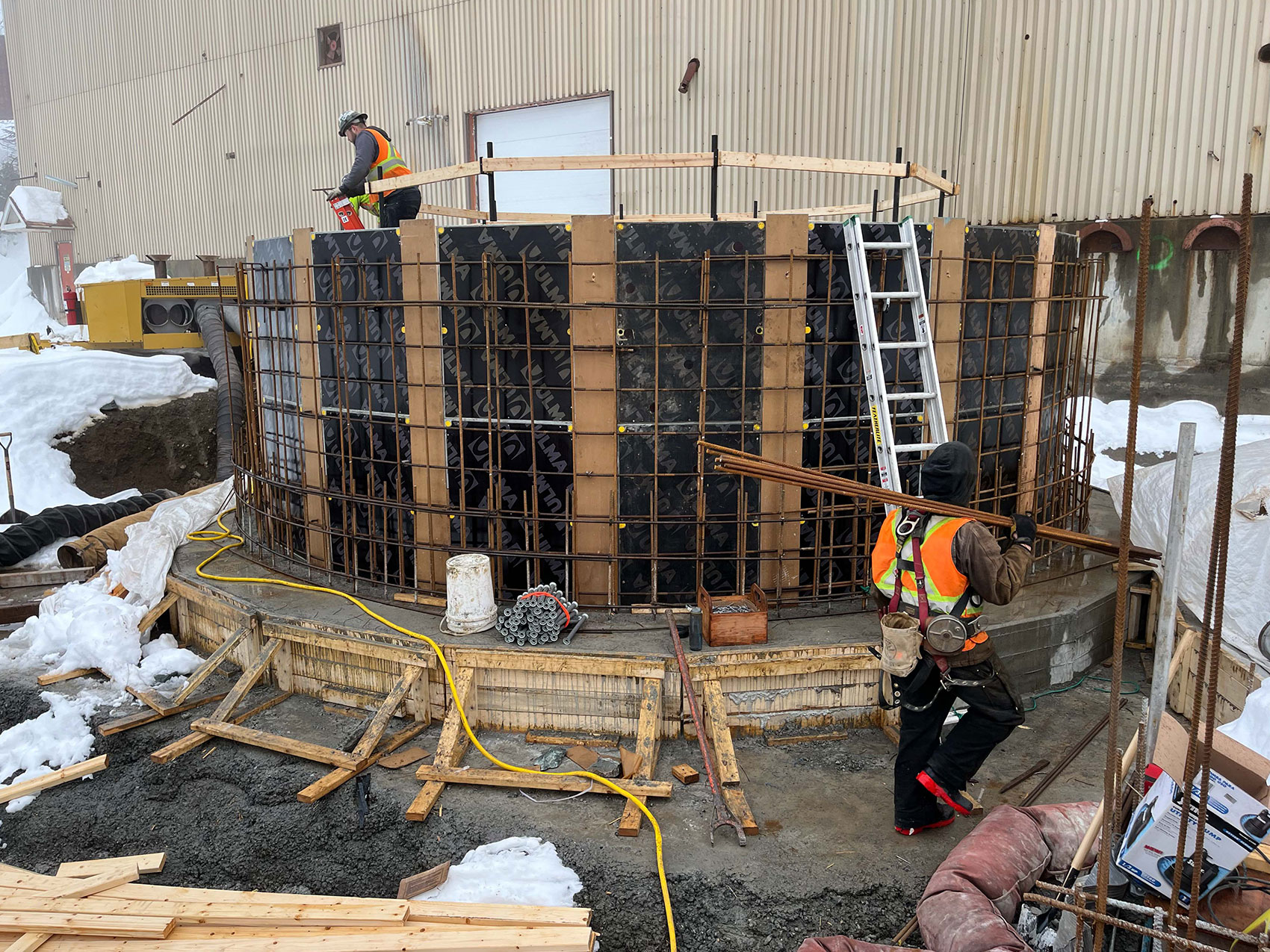 Workers prepareing rebar for concrete pouring