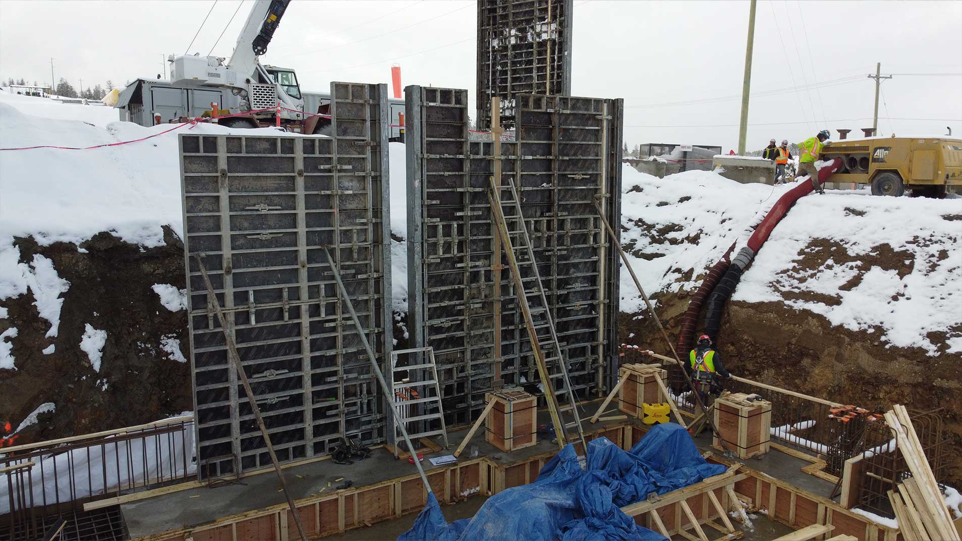 High concrete walls being poured